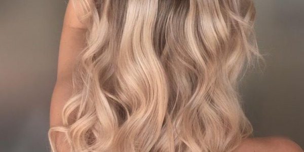 The Secret to Flawless Locks: Exploring the Surprising Benefits of Tape-In Hair Extensions